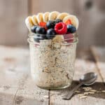 Creamy overnight oats with mixed berries, banana, and chia seeds.