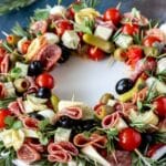 Juicy charcuterie wreath with meats, cheeses, fruits, and nuts