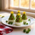Festive Christmas Tree Deviled Eggs with red pepper ornaments