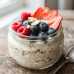 Creamy vanilla overnight oats topped with fresh berries and almonds.