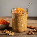Creamy carrot cake protein overnight oats in a rustic glass jar