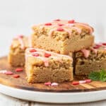 Soft almond flour sugar cookie bars with pink icing for Valentine's Day.
