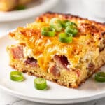 Bacon cheddar breakfast casserole recipe with crispy bacon and melted cheese.