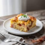 Simple breakfast casserole with hash browns, bacon, and melted cheese slice.