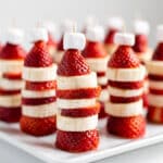 Colorful Cat in the Hat fruit skewers with strawberries and banana slices.