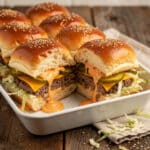 Copycat Big Mac Sliders recipe with beef, cheese, and special sauce on rolls.