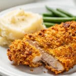 Crispy oven fried chicken recipe with golden breadcrumbs and tender juicy meat.