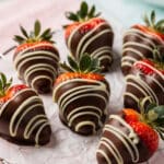 Easter chocolate covered strawberries with elegant white chocolate swirls.