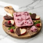 Easy healthy Valentine's treats for after school snacks on a rustic board.