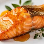 Honey glazed salmon fillet with crispy skin and glossy soy glaze