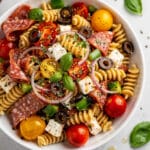 Colorful Italian pasta salad with rotini, salami, mozzarella, and fresh vegetables.