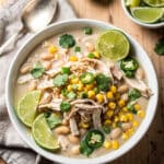 Creamy lime cilantro white chicken chili in a rustic white bowl
