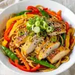 Easy chicken lo mein recipe with glossy noodles and colorful vegetables
