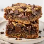 Thick chewy chocolate chip cookie bars with melty chocolate chips and golden edges