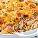 Spicy Southern chicken spaghetti casserole with creamy sauce and melted cheese.