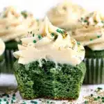 Green velvet cupcake with cream cheese frosting and gold sugar decoration