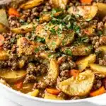 Hearty hobo casserole recipe with savory ground beef, potatoes, and carrots.