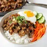 Quick easy Korean ground beef bowl over rice with vegetables and sesame seeds