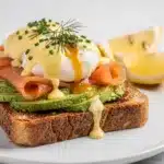 Smoked salmon and avocado eggs royale on toasted sourdough with hollandaise sauce