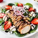 Strawberry balsamic chicken salad with juicy chicken and glossy glaze.