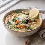 Creamy white bean kale soup recipe with vibrant greens and tender beans.