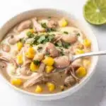 Creamy white chicken chili with corn and beans in a homemade bowl