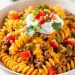 Creamy cheesy taco pasta with seasoned beef and melted cheese sauce