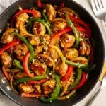 Easy skillet chicken stir fry recipe with tender chicken and crisp bell peppers