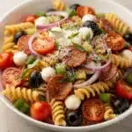 Cold Italian pasta salad with rotini, fresh veggies, and homemade dressing.