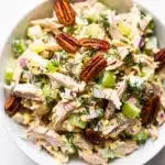 Creamy dill chicken salad recipe served on a toasted croissant half
