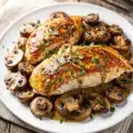 Creamy mushroom chicken breast in rich sauce over fluffy mashed potatoes.