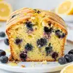 Lemon blueberry pound cake with tender crumb and juicy berries close up