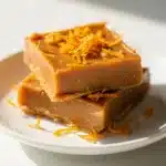 Creamy peanut butter fudge with a bright orange zest twist on marble.