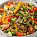 Colorful quinoa salad with fresh vegetables in a bright, healthy homemade meal.