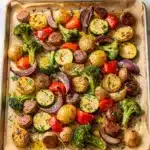 Sheet pan sausage and veggies recipe with roasted sausage and glossy vegetables