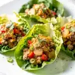 Savory ground turkey lettuce wraps with colorful vegetables and sesame seeds