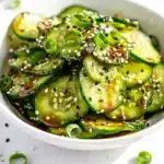 Crisp Asian cucumber salad with sesame in glossy homemade sesame dressing