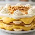 Creamy banana pudding icebox cake layers in a chilled glass trifle dish
