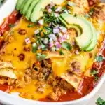 Crispy fried tortillas hold savory bean and cheese enchiladas perfectly.