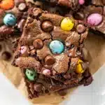 Fudgy brownie cookie bars with chopped Cadbury Mini Eggs for Easter baking.