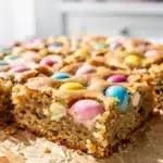 Cadbury Mini Egg blondies with a glossy chocolate top and crispy candy shell.