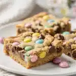Cadbury Mini Egg cookie bars with pastel candy shells and chocolate chips.
