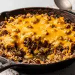Cheesy ground beef and rice skillet recipe with creamy melted cheese and tender rice