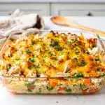 Creamy cheesy chicken and rice casserole with golden crispy baked edges