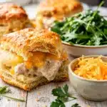 Golden flaky biscuits stuffed with creamy chicken and melted cheddar cheese.