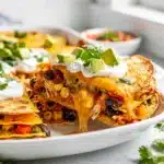 Golden chicken quesadilla bake with melty cheese and crispy tortilla edges.
