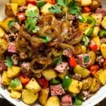 Crispy corned beef hash with caramelized onions and a fried egg