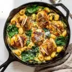Creamy chicken gnocchi skillet with parmesan sauce and fresh spinach