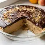 Creamy chocolate peanut butter frozen pie slice in close up Pinterest style