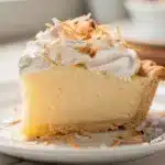 Coconut cream pie with creamy custard and toasted coconut topping close up